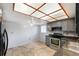 Eat-in kitchen with stainless steel appliances and wood-look floors at 7717 Cosme Dr # 2, Hudson, FL 34667