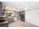 Spacious kitchen, stainless steel appliances, and white pantry at 7717 Cosme Dr # 2, Hudson, FL 34667