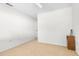 Simple bedroom with wood accent table and carpet at 8190 Sturbridge Ct, Weeki Wachee, FL 34613