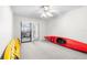 Bedroom with sliding door to patio and two kayaks at 8190 Sturbridge Ct, Weeki Wachee, FL 34613
