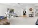 Bright living room with open floor plan and kitchen view at 8190 Sturbridge Ct, Weeki Wachee, FL 34613