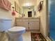 Functional bathroom with a toilet, vanity with storage, and shower stall for convenience at 8704 Winding Wood Dr, Port Richey, FL 34668