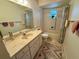 Bathroom with tub, sink, and toilet at 8704 Winding Wood Dr, Port Richey, FL 34668