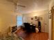 Bedroom with desk, chair, and bed at 8704 Winding Wood Dr, Port Richey, FL 34668