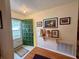 Welcoming entryway with a green door, complemented by stylish décor and warm lighting at 8704 Winding Wood Dr, Port Richey, FL 34668