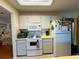 Functional kitchen featuring white cabinetry and essential appliances for everyday cooking needs at 8704 Winding Wood Dr, Port Richey, FL 34668