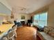 Comfortable living room with wood floors and a recliner at 8704 Winding Wood Dr, Port Richey, FL 34668