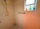 Basic shower stall with tile walls and minimal fixtures; a clean and simple space at 8704 Winding Wood Dr, Port Richey, FL 34668