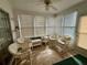 Bright sunroom with ample natural light and comfortable seating, ideal for relaxing and unwinding at 8704 Winding Wood Dr, Port Richey, FL 34668