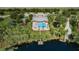 Aerial view of the community amenities by the lake at 11645 Belle Haven Dr, New Port Richey, FL 34654