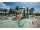 splash pad with slide at the community pool at 11645 Belle Haven Dr, New Port Richey, FL 34654