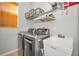 Laundry room with washer, dryer, and utility sink at 11645 Belle Haven Dr, New Port Richey, FL 34654