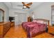 Cozy bedroom with wood flooring, a comfortable bed, and neutral walls for a relaxing retreat at 11645 Belle Haven Dr, New Port Richey, FL 34654