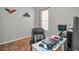 Home office with desk, chair, and large window at 11645 Belle Haven Dr, New Port Richey, FL 34654