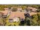 Aerial view of community with numerous homes and lush green landscaping at 12814 Wedgewood Way # C, Hudson, FL 34667