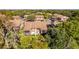 Condo building with screened porch and wooded area at 12814 Wedgewood Way # C, Hudson, FL 34667