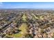 Aerial view of community near golf course and ocean at 12814 Wedgewood Way # C, Hudson, FL 34667