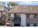 Private balcony with table and grill, offering an outdoor space at 12814 Wedgewood Way # C, Hudson, FL 34667
