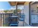 Relaxing balcony features table and chairs with view of community at 12814 Wedgewood Way # C, Hudson, FL 34667
