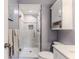 Updated bathroom with a walk-in shower and vanity at 12814 Wedgewood Way # C, Hudson, FL 34667