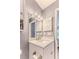 Vanity with modern sink and updated lighting at 12814 Wedgewood Way # C, Hudson, FL 34667