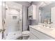 Updated bathroom with a walk-in shower and vanity at 12814 Wedgewood Way # C, Hudson, FL 34667