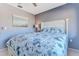Bedroom with a white bed frame and blue walls at 12814 Wedgewood Way # C, Hudson, FL 34667