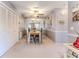 Bright dining room with rustic table and colorful chairs at 12814 Wedgewood Way # C, Hudson, FL 34667