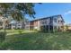 Exterior view of condo building showcasing landscaping at 12814 Wedgewood Way # C, Hudson, FL 34667
