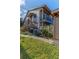 Condo building exterior with stairs and landscaping at 12814 Wedgewood Way # C, Hudson, FL 34667