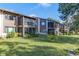 Condo building showcasing well-maintained grounds at 12814 Wedgewood Way # C, Hudson, FL 34667