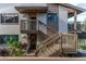 Condo building exterior with stairs and landscaping at 12814 Wedgewood Way # C, Hudson, FL 34667