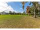 Landscaped golf course with mature trees and lush grass at 12814 Wedgewood Way # C, Hudson, FL 34667