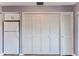 White refrigerator and built-in cabinets in a galley kitchen at 12814 Wedgewood Way # C, Hudson, FL 34667