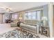 Living room with plush sofas and large windows at 12814 Wedgewood Way # C, Hudson, FL 34667