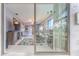View of living room through sliding glass doors at 12814 Wedgewood Way # C, Hudson, FL 34667