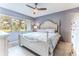 Main bedroom with a large bed and lots of natural light at 12814 Wedgewood Way # C, Hudson, FL 34667