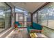 Spacious screened porch boasts comfortable seating and natural light at 12814 Wedgewood Way # C, Hudson, FL 34667