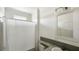 Simple, clean bathroom with a shower/tub combo and granite countertop at 14287 Rialto Ave, Brooksville, FL 34613