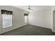 Cozy carpeted bedroom with soft lighting and plenty of natural light at 14287 Rialto Ave, Brooksville, FL 34613