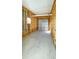 Unfinished garage interior with exposed framing and a single garage door at 14287 Rialto Ave, Brooksville, FL 34613