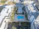Aerial view of condo complex and pool at 155 Bluff View Dr # 103, Belleair Bluffs, FL 33770