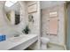Bathroom with vanity, toilet, and shower at 155 Bluff View Dr # 103, Belleair Bluffs, FL 33770