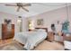 Comfortable bedroom featuring a double bed and dresser at 155 Bluff View Dr # 103, Belleair Bluffs, FL 33770