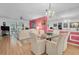 Charming dining area with glass table and seating for six at 155 Bluff View Dr # 103, Belleair Bluffs, FL 33770