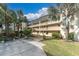 Exterior of condo building with balconies at 155 Bluff View Dr # 103, Belleair Bluffs, FL 33770