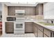 Well-equipped kitchen, featuring ample counter space and storage at 155 Bluff View Dr # 103, Belleair Bluffs, FL 33770