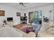 Spacious living room featuring ample seating and a view to the patio at 155 Bluff View Dr # 103, Belleair Bluffs, FL 33770