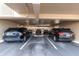 Covered parking garage with designated parking spaces at 155 Bluff View Dr # 103, Belleair Bluffs, FL 33770