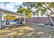 Inviting backyard oasis with covered patio, swing set, and sparkling pool at 15950 Adobe Dr, Hudson, FL 34667